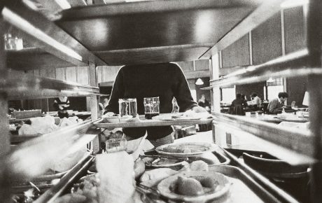 a student busses her tray at the Ratty